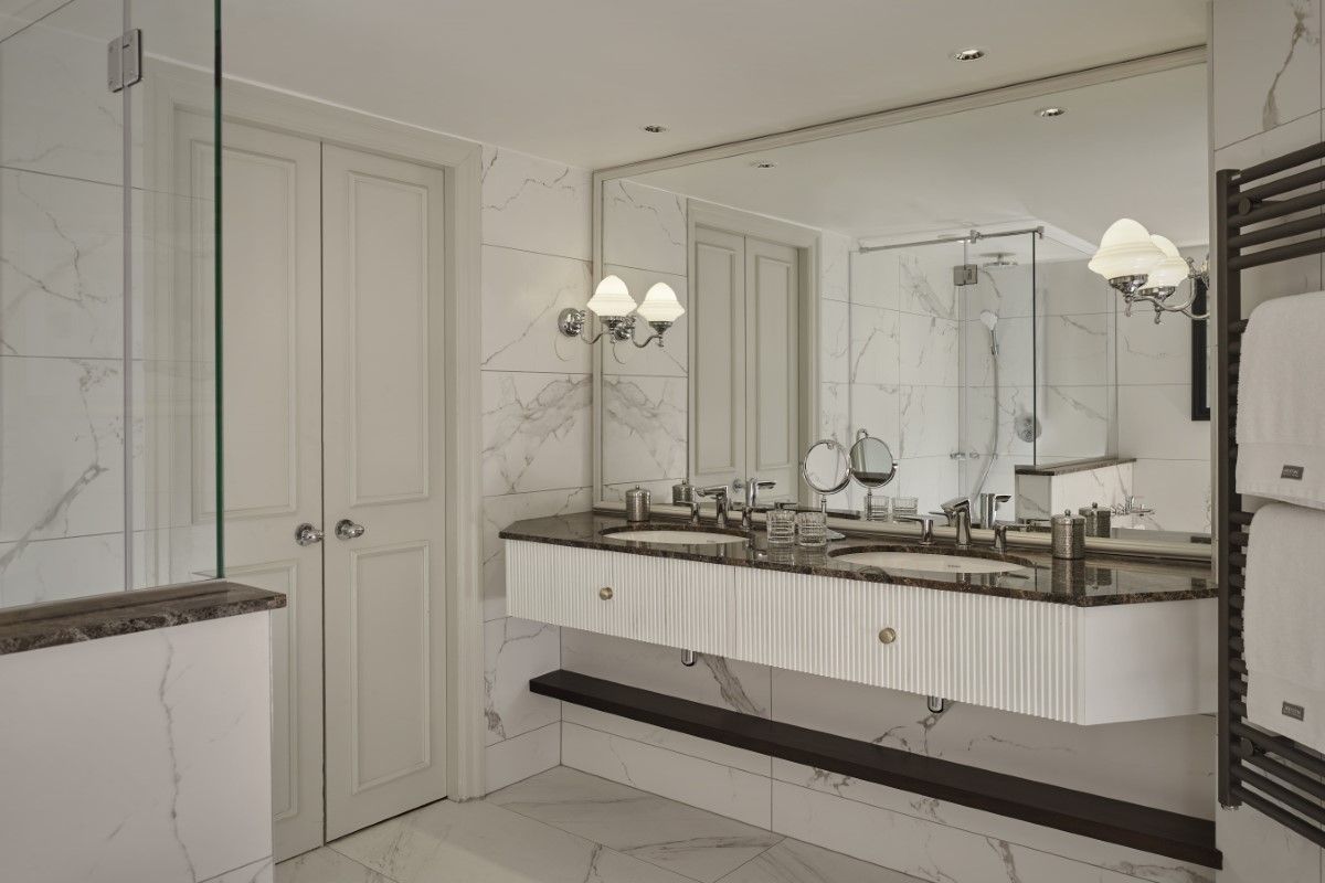 Large double vanity bathroom with white marble in The College Green Hotel Dublin