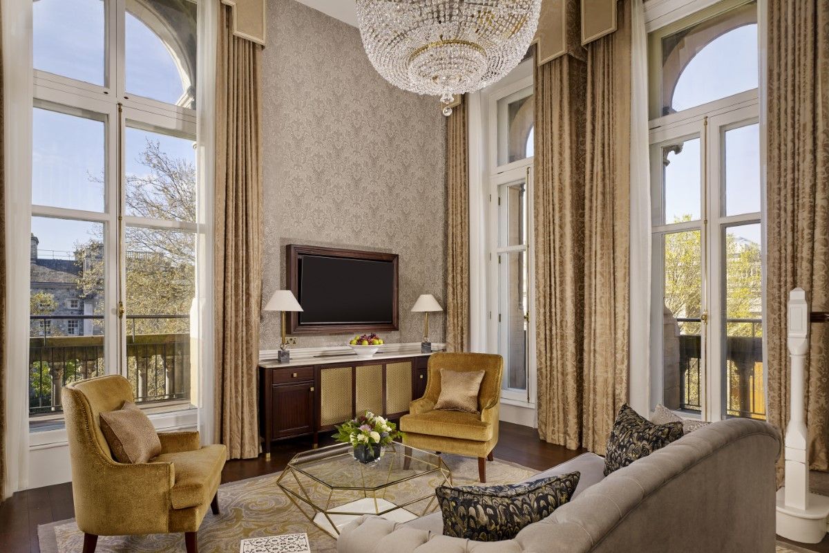 Living space with couches, television and view overlooking Trinity College