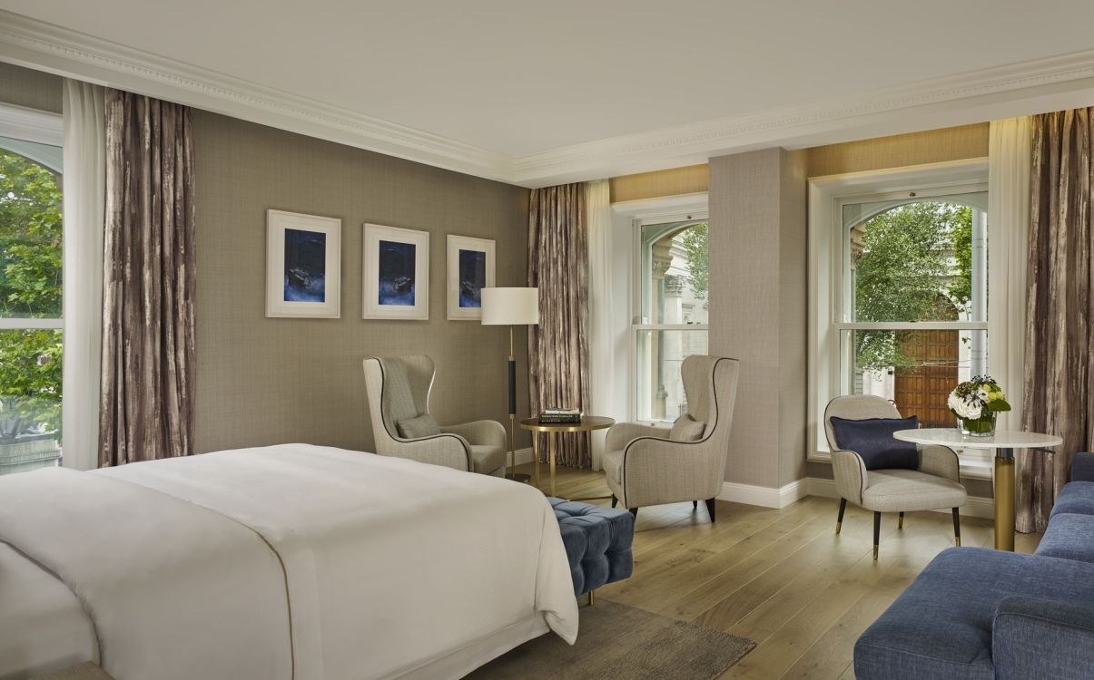 Large suite with living space and view of Dublin city in The College Green Hotel Dublin