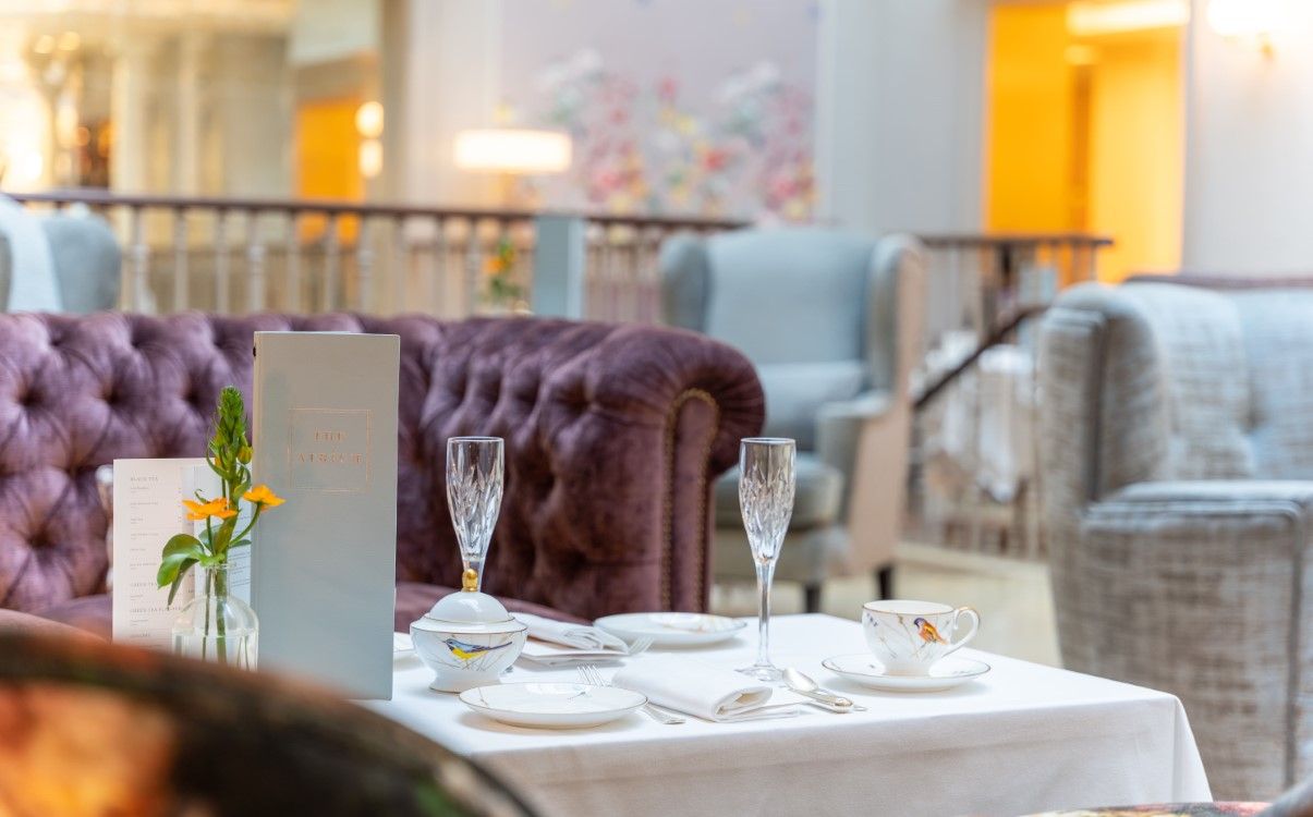 Table set with crockery and Champagne glasses