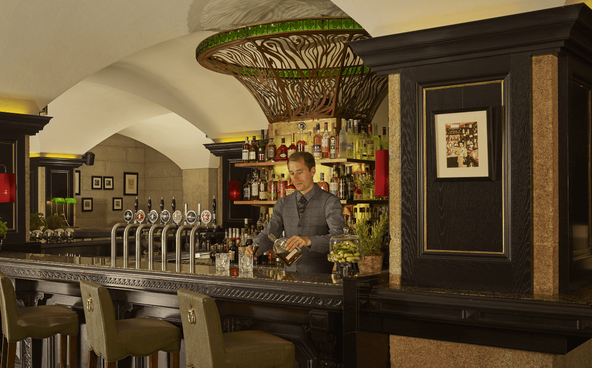 Mixologist serving a drink in The Mint Bar in The College Green Hotel Dublin