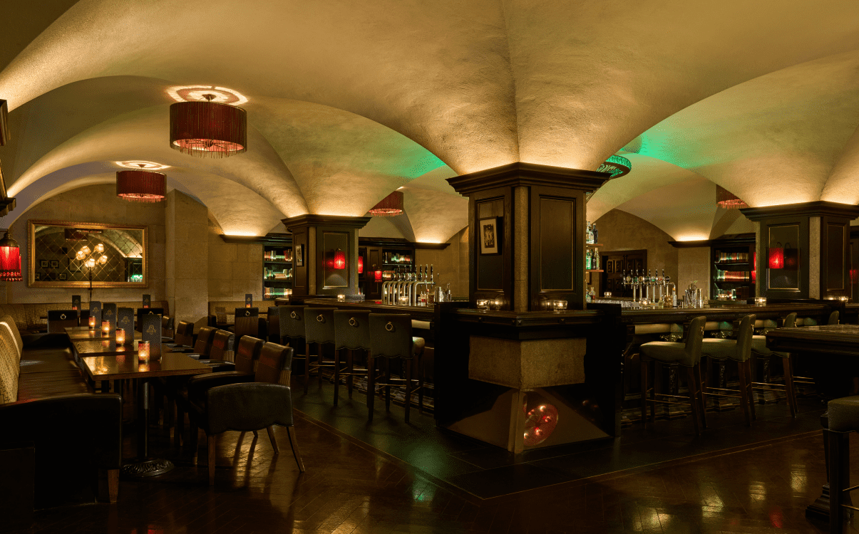 Wide angle of The Mint Bar with tables and chairs set for service