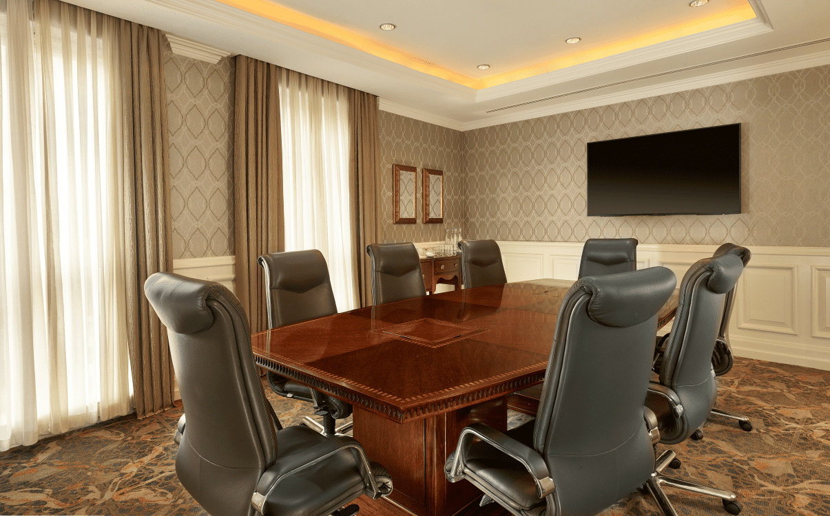Private meeting room with large table, chairs and television in The College Green Hotel Dublin