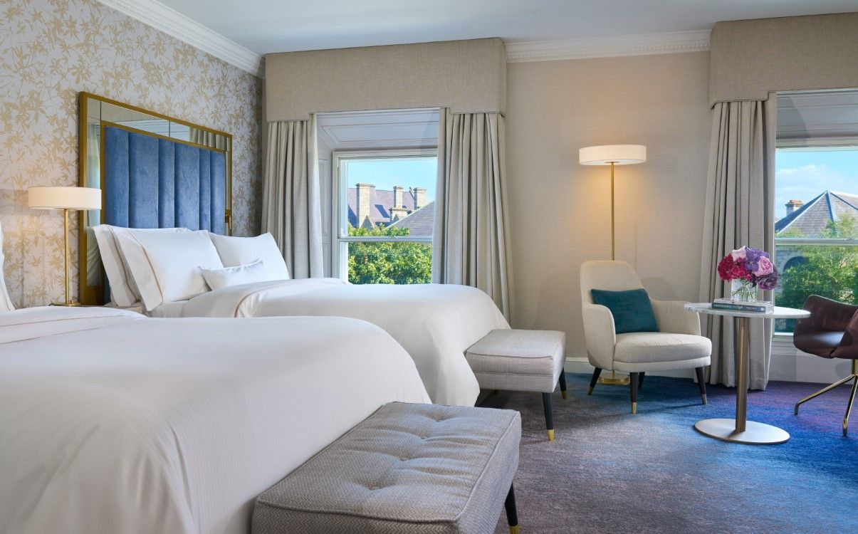 Large double room with two queen beds and view overlooking the city