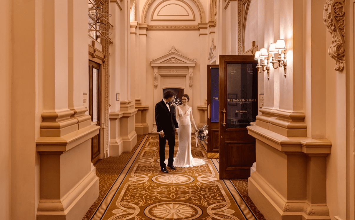 Wedding couple grand entrance into The Banking Hall